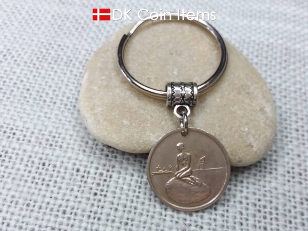 Denmark Little Mermaid coin keychain with Copenhagen Little Mermaid fare token.