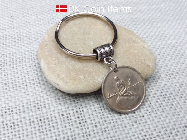 Denmark Little Mermaid coin keychain with Copenhagen Little Mermaid fare token.