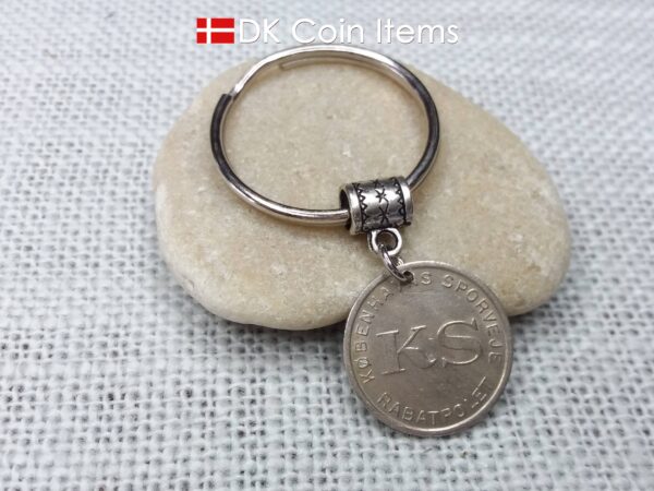 Denmark Little Mermaid coin keychain with Copenhagen Little Mermaid fare token.