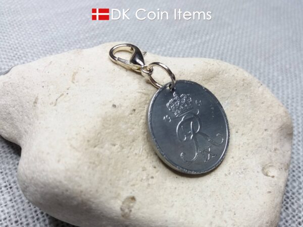 1961 coin charm with 63 year old Danish Crown R-initial 5 ore as pendant on lobster claw