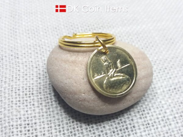 Denmark coin keychain with The Little Mermaid on a vintage fare token coin from Copenhagen