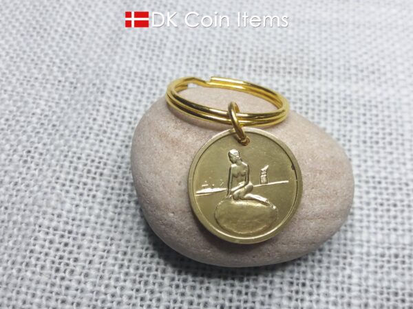 Denmark coin keychain with The Little Mermaid on a vintage fare token coin from Copenhagen