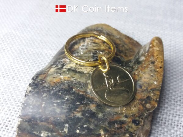 Denmark coin keychain with The Little Mermaid on a vintage fare token coin from Copenhagen