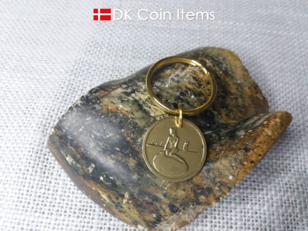 Denmark coin keychain with The Little Mermaid on a vintage fare token coin from Copenhagen