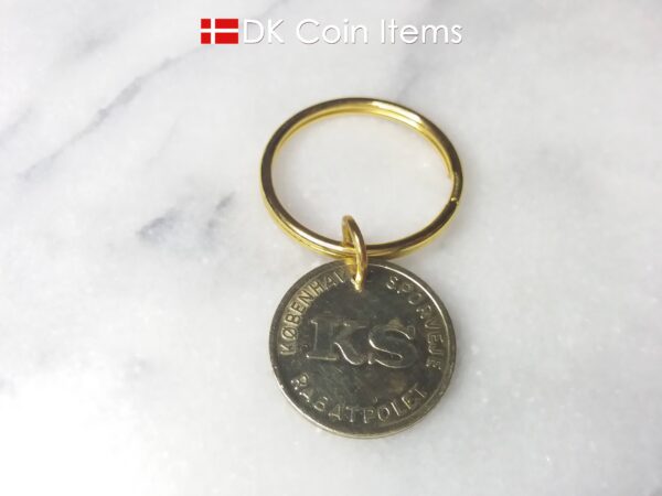 Denmark coin keychain with The Little Mermaid on a vintage fare token coin from Copenhagen