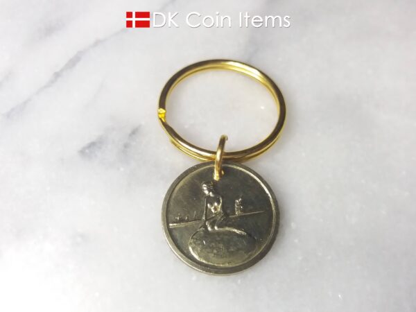 Denmark coin keychain with The Little Mermaid on a vintage fare token coin from Copenhagen