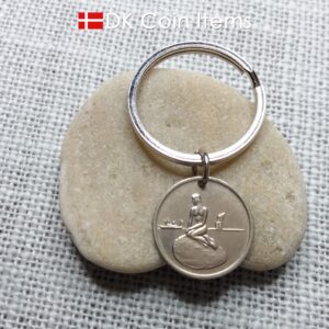 Coin pendant keychain with The Danish Little Mermaid statue/sculpture on a Copenhagen vintage fare token from 1966-1967