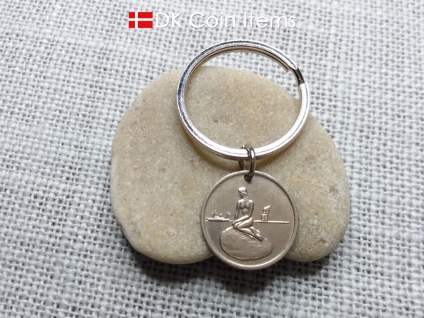 Coin pendant keychain with The Danish Little Mermaid statue/sculpture on a Copenhagen vintage fare token from 1966-1967