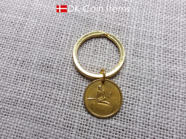 Danish coin pendant keychain with The Little Mermaid statue/sculpture on a Copenhagen vintage brass fare token from 1966-1967