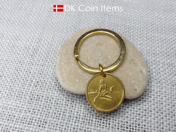 Danish coin pendant keychain with The Little Mermaid statue/sculpture on a Copenhagen vintage brass fare token from 1966-1967