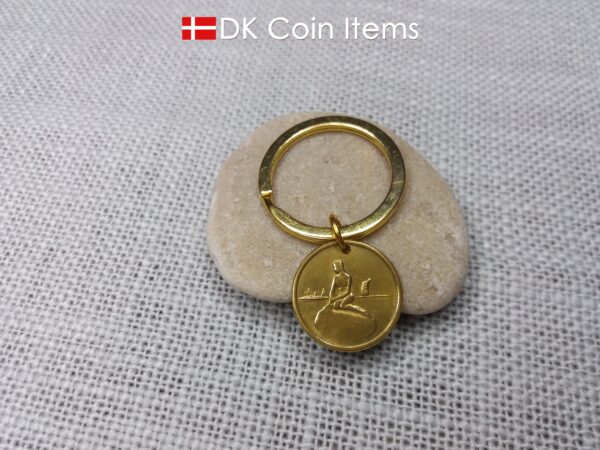 Danish coin pendant keychain with The Little Mermaid statue/sculpture on a Copenhagen vintage brass fare token from 1966-1967