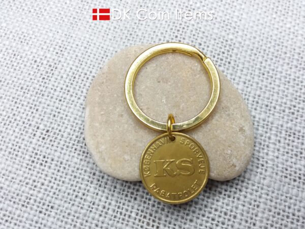 Danish coin pendant keychain with The Little Mermaid statue/sculpture on a Copenhagen vintage brass fare token from 1966-1967