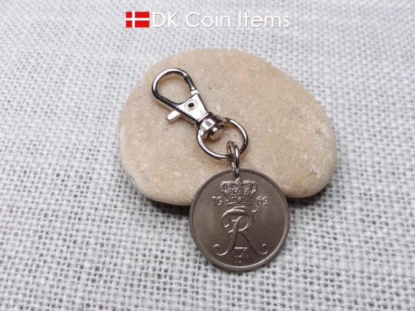 Denmark 1962 R-initial coin charm with 62 year old 25 ore as coin pendant on trigger clip with swivel base