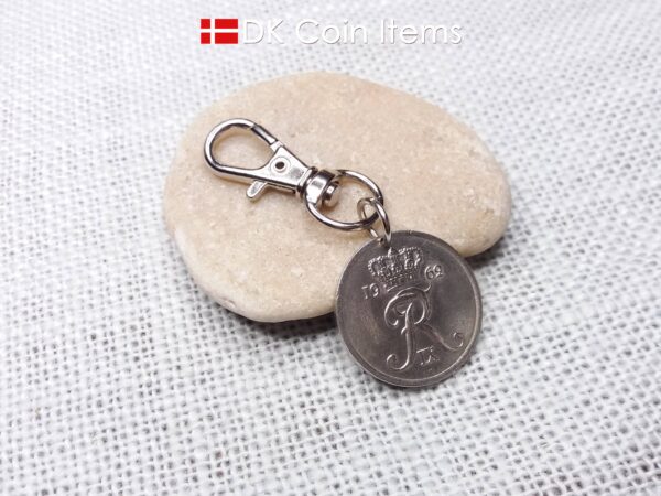 Denmark 1962 R-initial coin charm with 62 year old 25 ore as coin pendant on trigger clip with swivel base